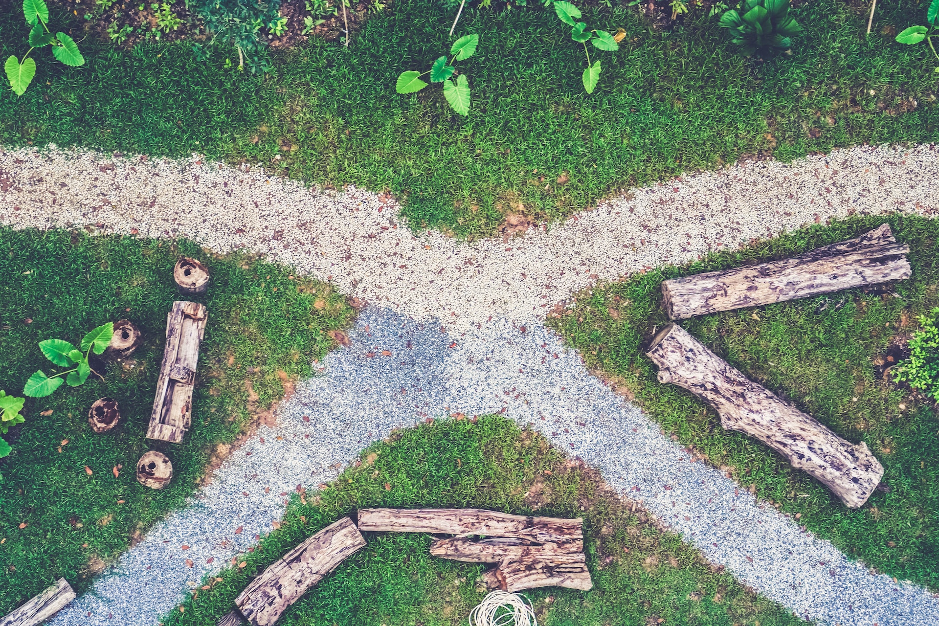 An image of a person standing at a crossroads, one path leading to adventure and travel, the other to financial planning and stability, symbolizing the choice between two different approaches to achieving immersive life goals.