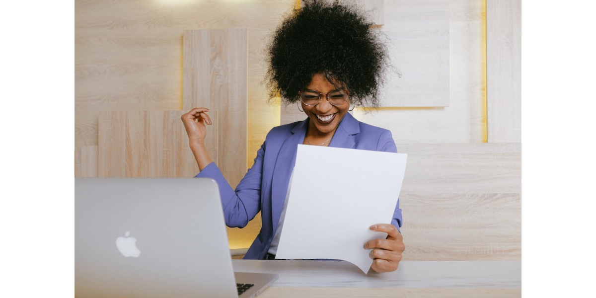 a lady celebrating her masterpiece after beating the Procrastination Beast